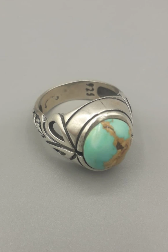 Silver 9.25 with turquoise stone.